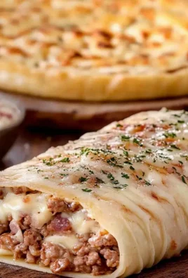 Roladki pizzowe z mięsem i serem – pyszna przekąska w 30 minut